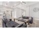 Living room with a view of kitchen, fireplace, and large windows at 12 E Quartz Rock Rd, Phoenix, AZ 85085