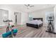 Spacious bedroom with a king-size bed, exercise equipment, and plenty of natural light at 12 E Quartz Rock Rd, Phoenix, AZ 85085