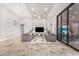Bright living room with high ceilings, sliding glass doors, and gray sofas at 12 E Quartz Rock Rd, Phoenix, AZ 85085