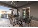 Covered patio with dining table and chairs, overlooking the backyard at 12 E Quartz Rock Rd, Phoenix, AZ 85085