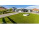 Luxury home with a large grassy yard, paver driveway, and mountain views at 12 E Quartz Rock Rd, Phoenix, AZ 85085
