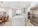 Spacious kitchen with white cabinets, quartz countertops, and stainless steel appliances at 12 E Quartz Rock Rd, Phoenix, AZ 85085