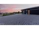 Modern home with a large, paved driveway and two-car garage at 12 E Quartz Rock Rd, Phoenix, AZ 85085