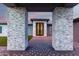 Ornate front door entrance framed by stone columns at 12 E Quartz Rock Rd, Phoenix, AZ 85085