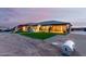 Large backyard with playground, artificial turf, and a spacious patio area at 12 E Quartz Rock Rd, Phoenix, AZ 85085