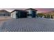 Modern attached garage with a large door and stylish design at 12 E Quartz Rock Rd, Phoenix, AZ 85085