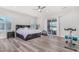 Bright bedroom with king-size bed, access to a patio, and room for fitness equipment at 12 E Quartz Rock Rd, Phoenix, AZ 85085