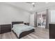 Bright bedroom with a queen bed, two nightstands, and access to a backyard patio at 12 E Quartz Rock Rd, Phoenix, AZ 85085