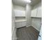 Bright laundry room with white cabinets and gray flooring at 13415 S Hermit Rd, Buckeye, AZ 85326