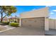 Attached garage with light taupe door and dark brown hardware at 6131 E Kings Ave, Scottsdale, AZ 85254