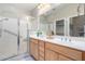 Double vanity bathroom with walk-in shower and ample storage at 10719 E Twister Ave, Mesa, AZ 85212