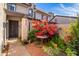 Inviting front patio with colorful bougainvillea and a small table at 2338 W Lindner Ave # 13, Mesa, AZ 85202