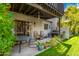 Covered patio features a table, chairs, and lush greenery at 2338 W Lindner Ave # 13, Mesa, AZ 85202