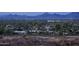 Aerial view of luxurious homes nestled in a mountain community, showcasing stunning city and mountain vistas at 6041 E Foothill N Dr, Paradise Valley, AZ 85253