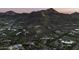 Aerial view of upscale homes with mountain backdrop; ideal for discerning buyers seeking breathtaking views at 6041 E Foothill N Dr, Paradise Valley, AZ 85253