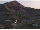Mountain view lot with access road. Stunning city views in the background at 6041 E Foothill N Dr, Paradise Valley, AZ 85253