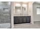 Bathroom with double vanity and walk-in shower at 11613 S 218Th Ave, Buckeye, AZ 85326