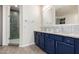 Double vanity bathroom with walk-in shower at 11613 S 218Th Ave, Buckeye, AZ 85326