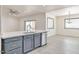 Kitchen island with sink and dishwasher, opens to dining area at 11613 S 218Th Ave, Buckeye, AZ 85326