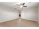 Bright bedroom with ceiling fan and laminate flooring at 9424 N 2Nd Pl, Phoenix, AZ 85020