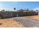 Gravel driveway and wooden fence leading to the backyard at 9424 N 2Nd Pl, Phoenix, AZ 85020