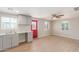 Updated kitchen showcasing gray cabinets and a red back door at 9424 N 2Nd Pl, Phoenix, AZ 85020