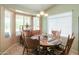 Cozy dining area with a round table and four chairs at 2380 E Seville E Ct, Casa Grande, AZ 85194