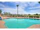 Inviting community pool with lounge chairs and scenic views at 2380 E Seville E Ct, Casa Grande, AZ 85194