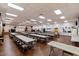 Spacious community room with numerous tables and chairs for gatherings at 11596 W Sierra Dawn Blvd # 196, Surprise, AZ 85378