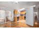 Dining area with wood flooring, a chandelier, and an open view of the kitchen at 11596 W Sierra Dawn Blvd # 196, Surprise, AZ 85378