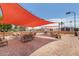 Outdoor patio area with shade sail and comfortable seating at 11596 W Sierra Dawn Blvd # 196, Surprise, AZ 85378
