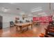 Well-lit game room with two billiard tables and seating at 11596 W Sierra Dawn Blvd # 196, Surprise, AZ 85378