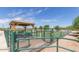 Covered dog park area with benches and agility equipment at 11596 W Sierra Dawn Blvd # 196, Surprise, AZ 85378