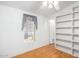 Bedroom with built-in shelves and wood flooring at 11596 W Sierra Dawn Blvd # 196, Surprise, AZ 85378