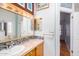 Bathroom features a sink, vanity, and tiled backsplash at 11596 W Sierra Dawn Blvd # 196, Surprise, AZ 85378