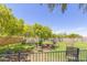 Outdoor seating area with wrought iron furniture under shade at 11596 W Sierra Dawn Blvd # 196, Surprise, AZ 85378