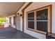 House exterior with a covered porch and large windows at 11596 W Sierra Dawn Blvd # 196, Surprise, AZ 85378