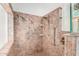 Walk-in shower with decorative wall and safety features at 11596 W Sierra Dawn Blvd # 196, Surprise, AZ 85378