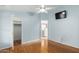 Bright bedroom with wood floors, ceiling fan, and ample closet space at 11596 W Sierra Dawn Blvd # 196, Surprise, AZ 85378