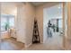 Well-lit bathroom hallway with a stylish shelf and access to bedrooms at 4226 E Coconino Pl, Chandler, AZ 85249