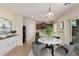 Virtually staged dining area with table and chairs at 33025 N Mildred Ln, San Tan Valley, AZ 85144