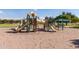 Modern playground with climbing structures and slides at 33025 N Mildred Ln, San Tan Valley, AZ 85144