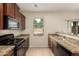 Kitchen with granite countertops and stainless steel appliances at 33025 N Mildred Ln, San Tan Valley, AZ 85144