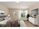 Spacious bedroom with neutral walls and carpeting, featuring a large window and ample closet space at 33025 N Mildred Ln, San Tan Valley, AZ 85144