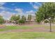 Park view with grassy lawn and community building at 33025 N Mildred Ln, San Tan Valley, AZ 85144
