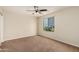 Bedroom with neutral walls, carpet, a ceiling fan, and a window at 33025 N Mildred Ln, San Tan Valley, AZ 85144