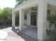 Covered patio with ceiling fan and sliding glass door at 43624 W Bailey Dr, Maricopa, AZ 85138