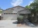 Single-story house with two-car garage and landscaping at 43624 W Bailey Dr, Maricopa, AZ 85138