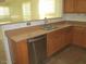 Kitchen with double sink and dishwasher at 43624 W Bailey Dr, Maricopa, AZ 85138