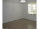 Bright dining room with tile floors and a chandelier at 43624 W Bailey Dr, Maricopa, AZ 85138